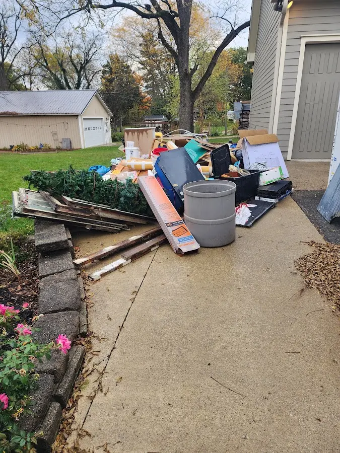 Dumpster being loaded with debris for Roofing Dumpster Rental in Dacono